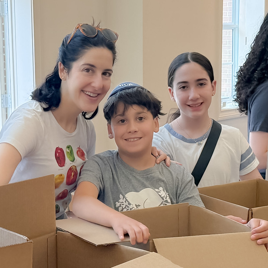 Volunteers packing food boxes at JRA